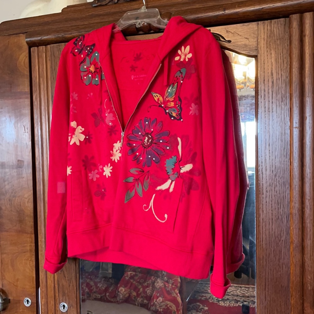 Oper in London red hooded jacket